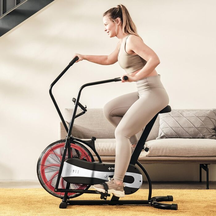 Велотренажер SportPlus Air Bike з повітряним опором, сумісний з додатком, для HIIT, домашній фітнес, підсвічування дисплея, навантаження до 100 кг, чорний/червоний, не підтримує додатки